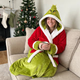 Heated Grump Robe worn on the sofa with a mug of tea